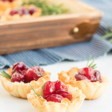 Cranberry Brie Bites- picture of phyllo dough cups filled with brie and cranberries