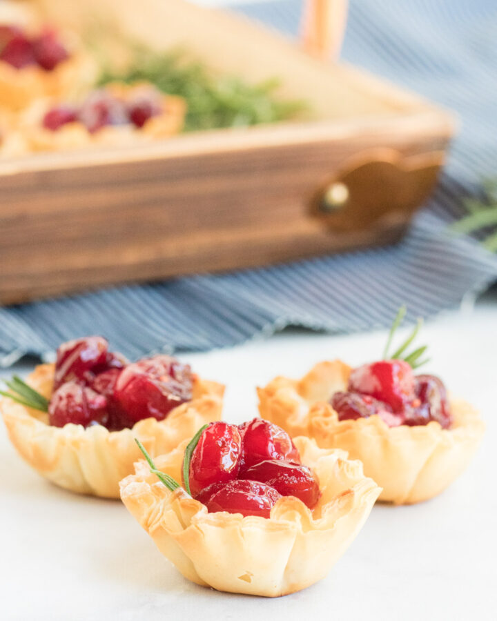 Cranberry Brie Bites- picture of phyllo dough cups filled with brie and cranberries