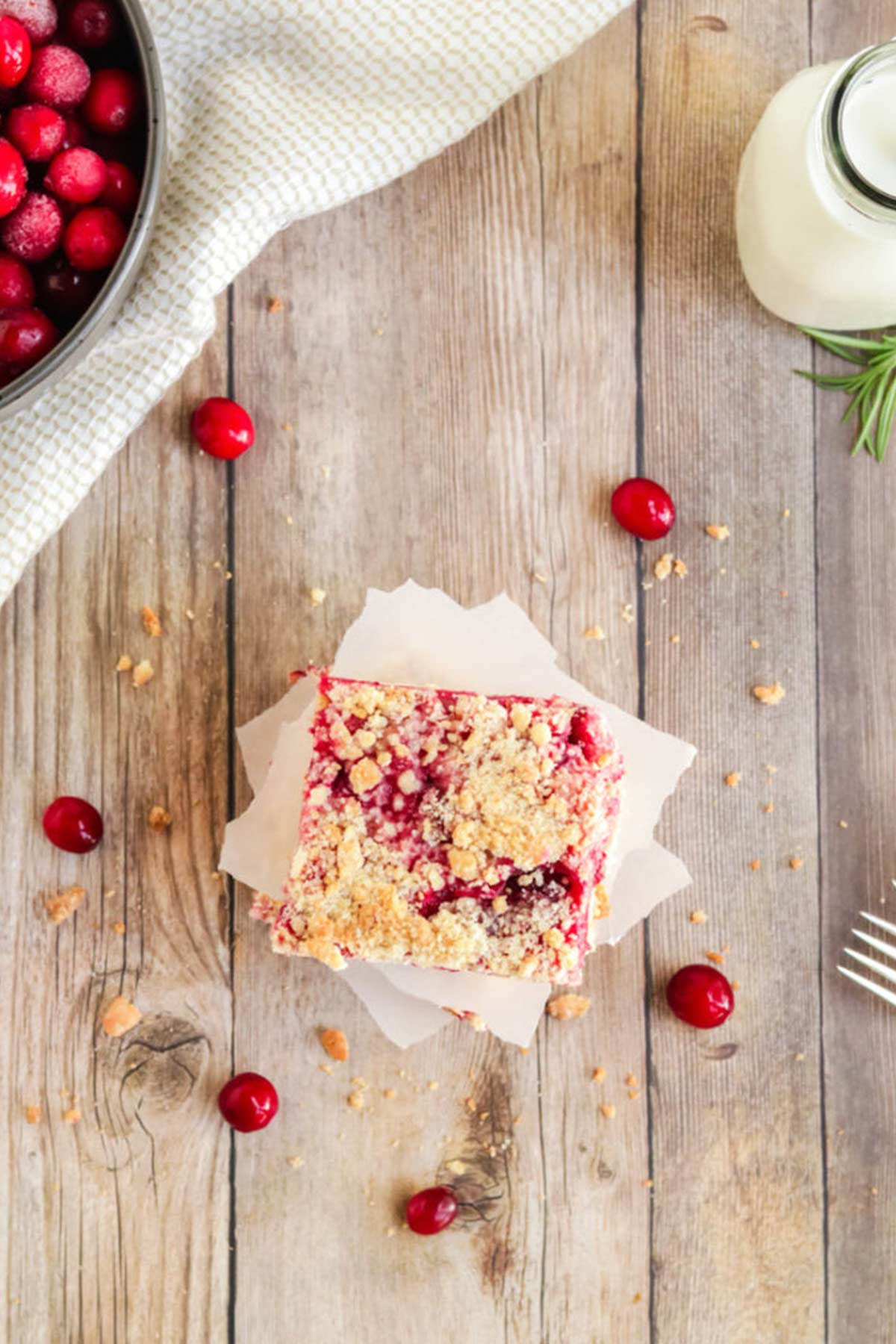 Overhead shot of a stack of fresh cranberry bars on the table.