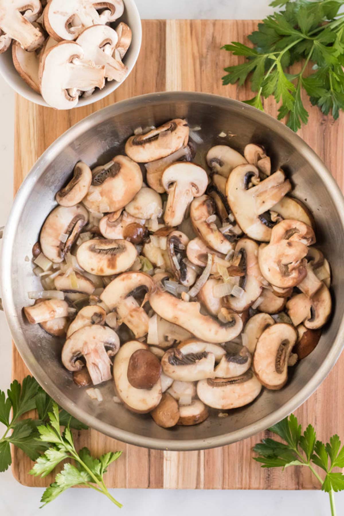 Mushrooms cooking in the pan to make the Champagne sauce.