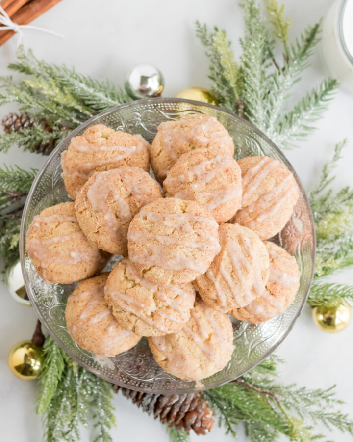A platter of egg nog cookies surrounded by a christmas wreath