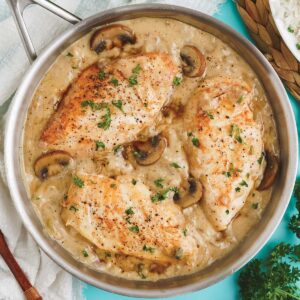 Champagne chicken cooked in a skillet.