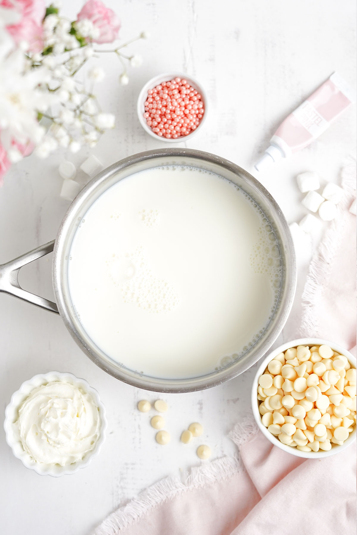 Heating the milk to pink hot chocolate.