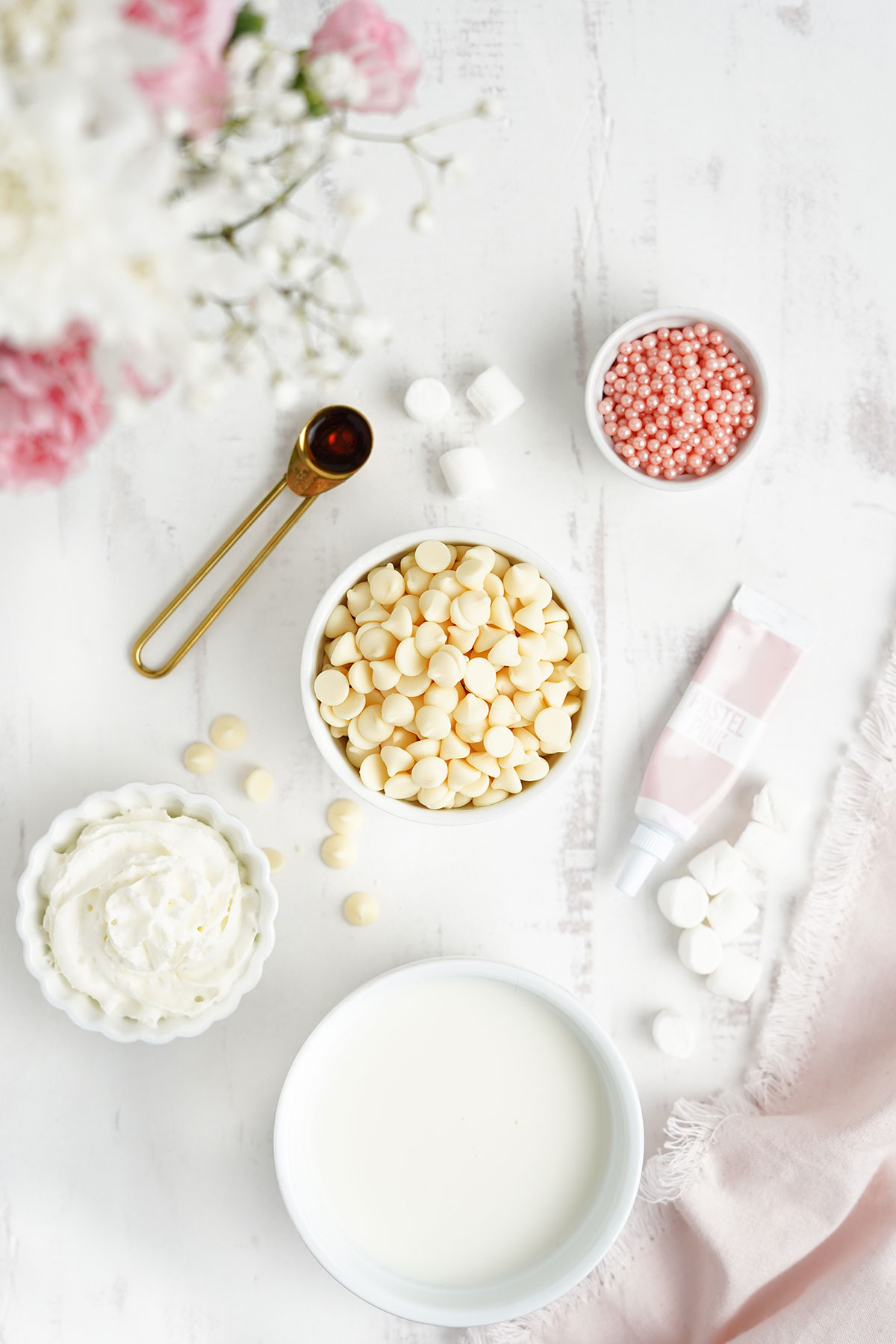 Ingredients for making pink hot chocolate on the table.