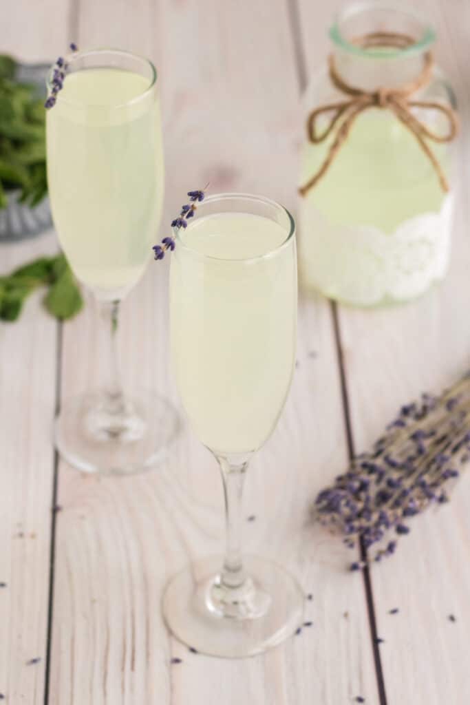 A Lavender Mimosa with a garnish of dried lavender on the rim.