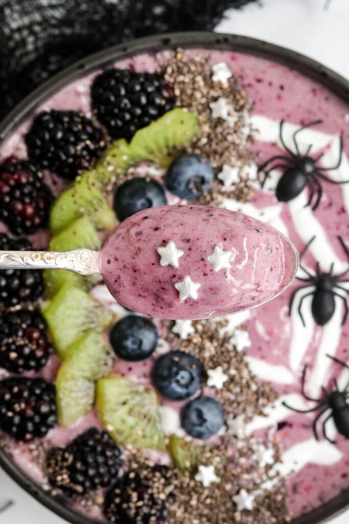 A close up image of a spoonful of Halloween Smoothie Bowl