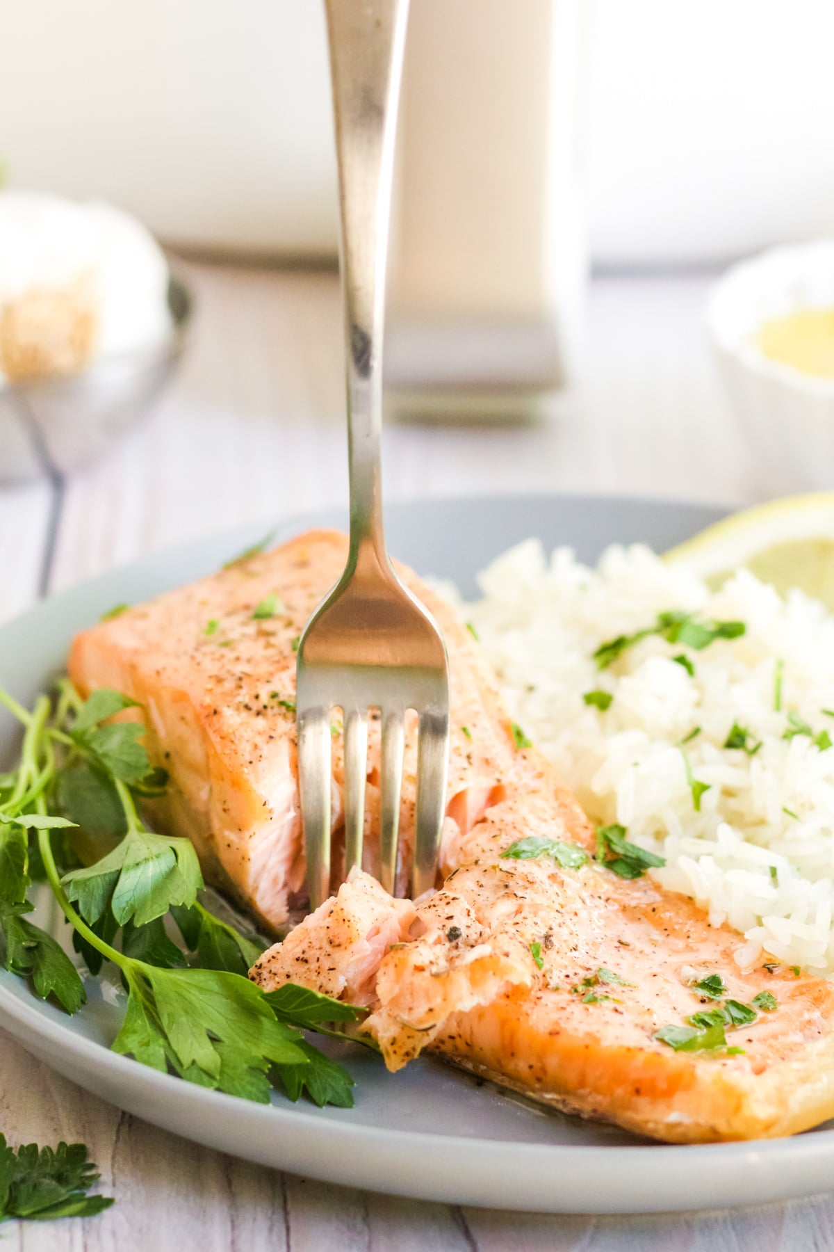 Air Fryer Salmon being flaked with a fork.