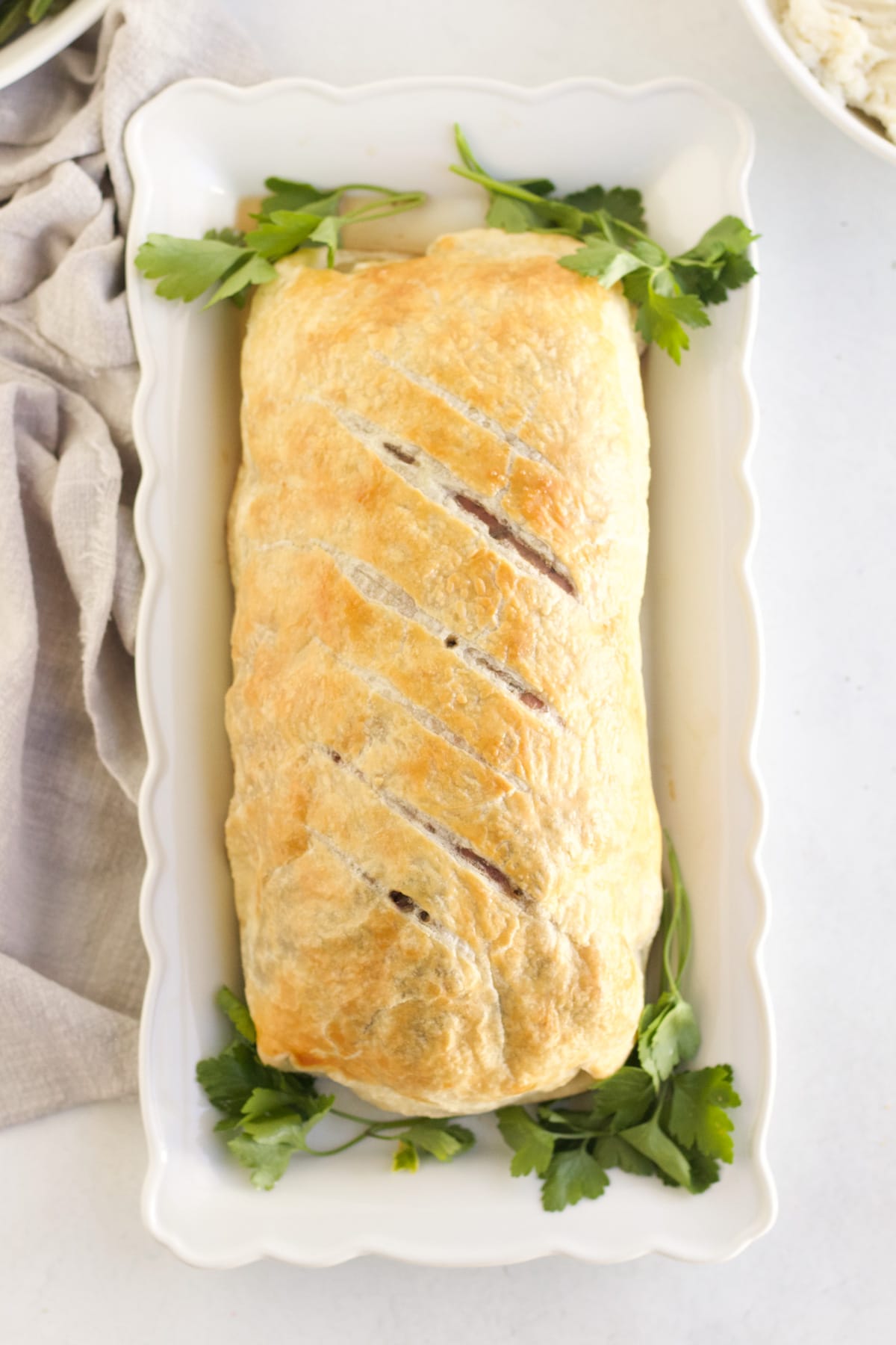 An overhead image of Beef Wellington after being taken out of the oven. 