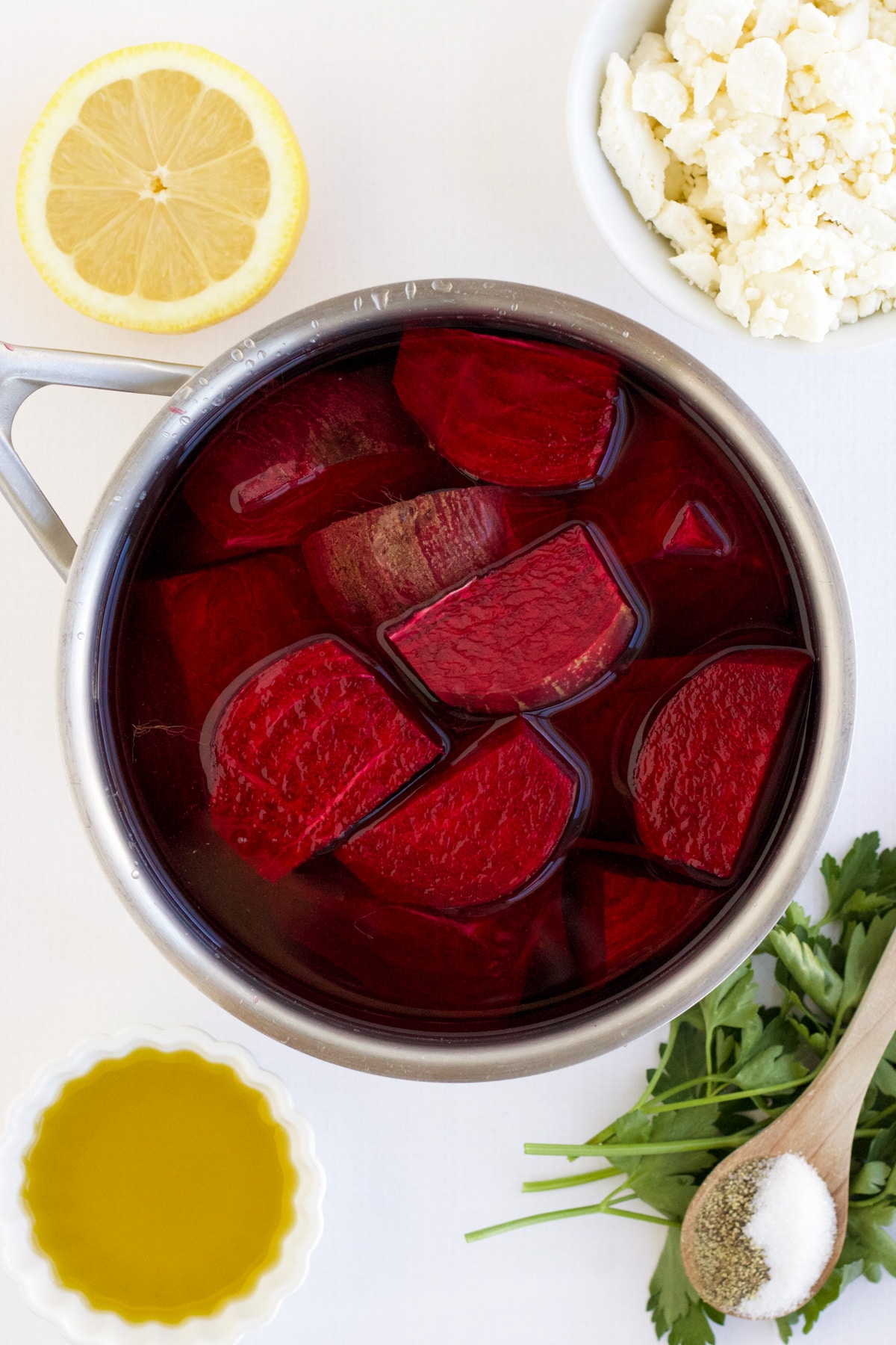 Beets in a saucepan in preparation of being cooked for beetroot feta salad. 