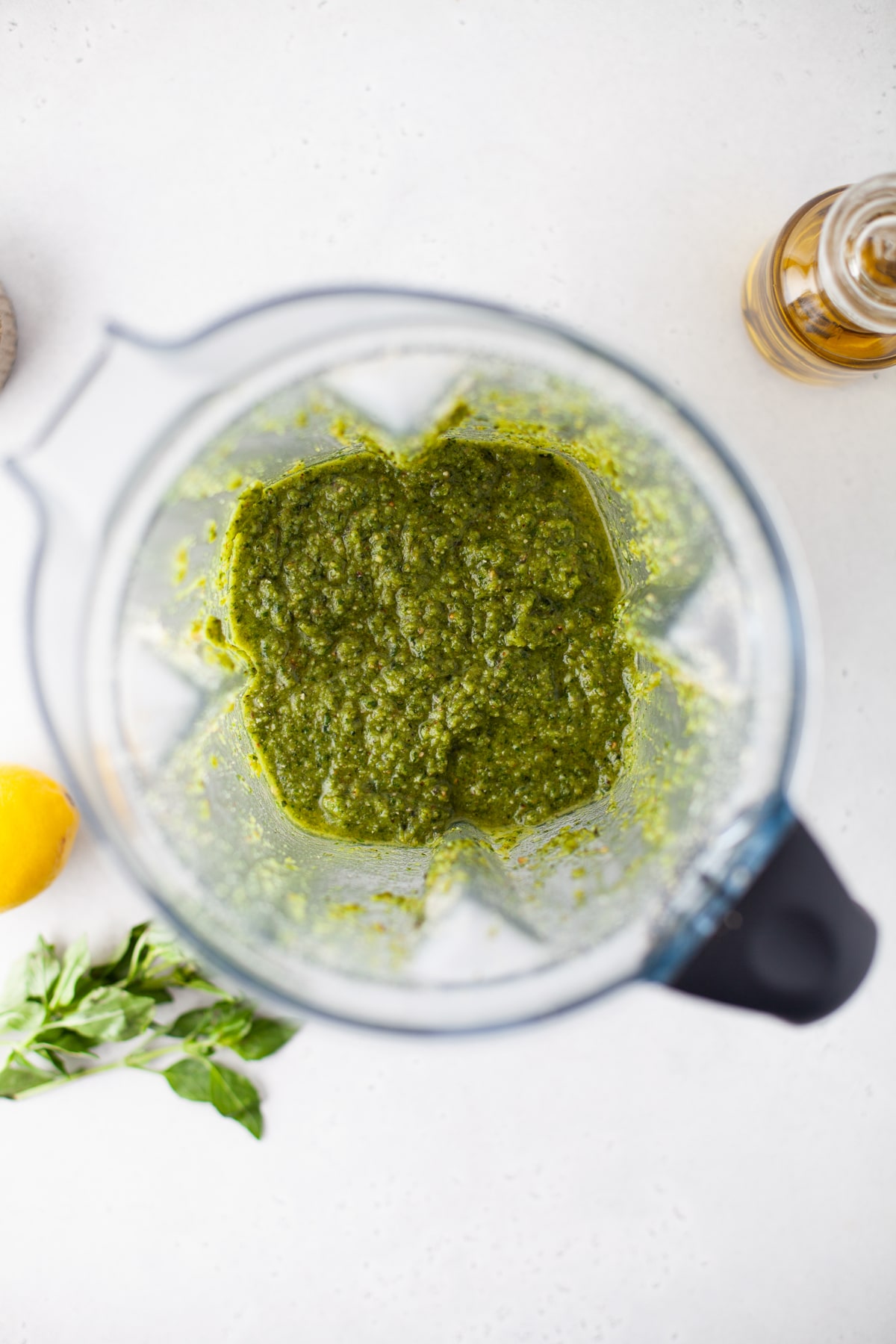 An overhead image of pureed cashew pesto inside of a blender. 