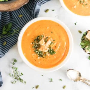 an overhead image of a bowl of vegan butternut squash soup