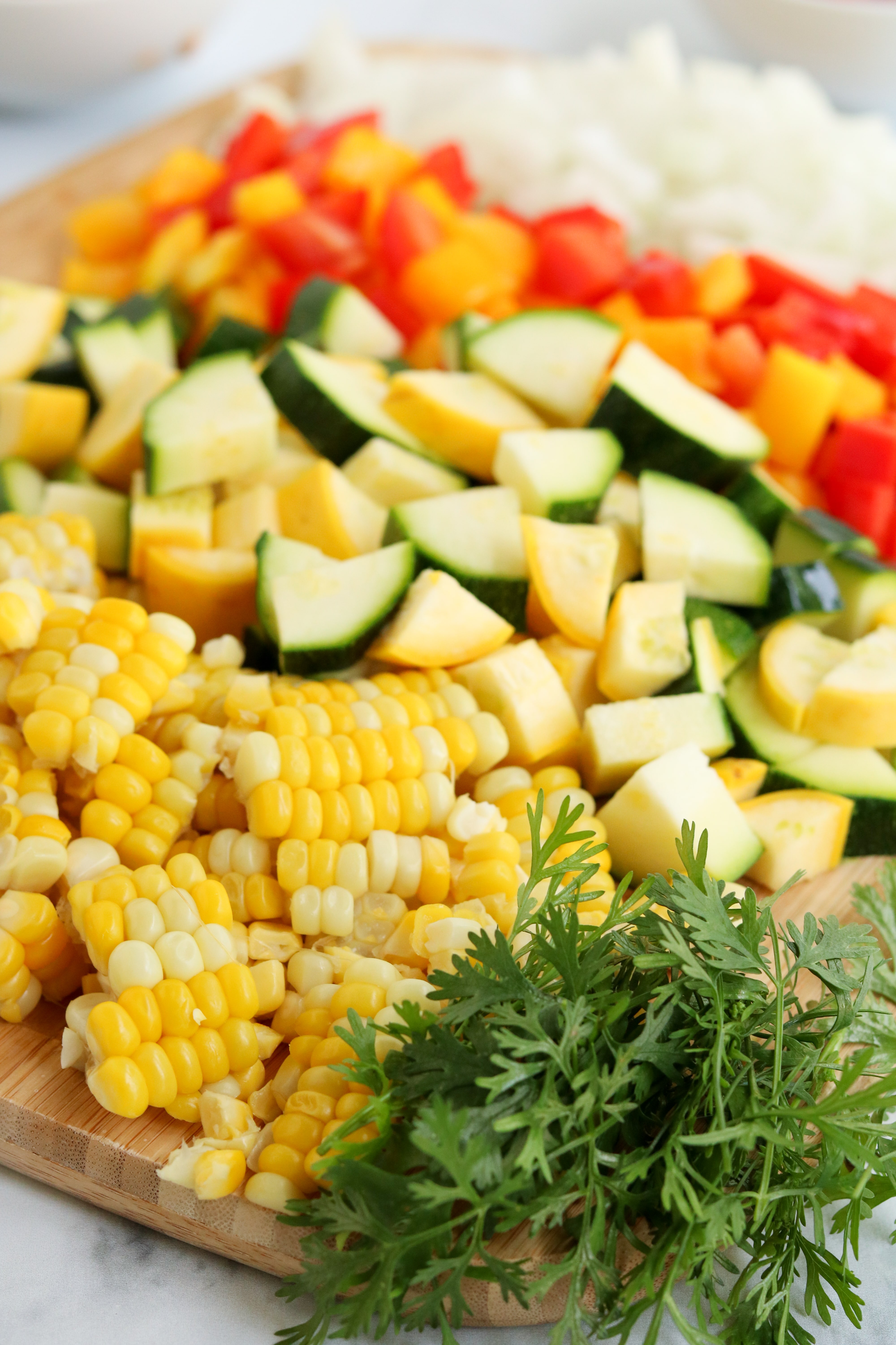 chopped corn, squash, zucchini, bell pepper, onion, and cilantro