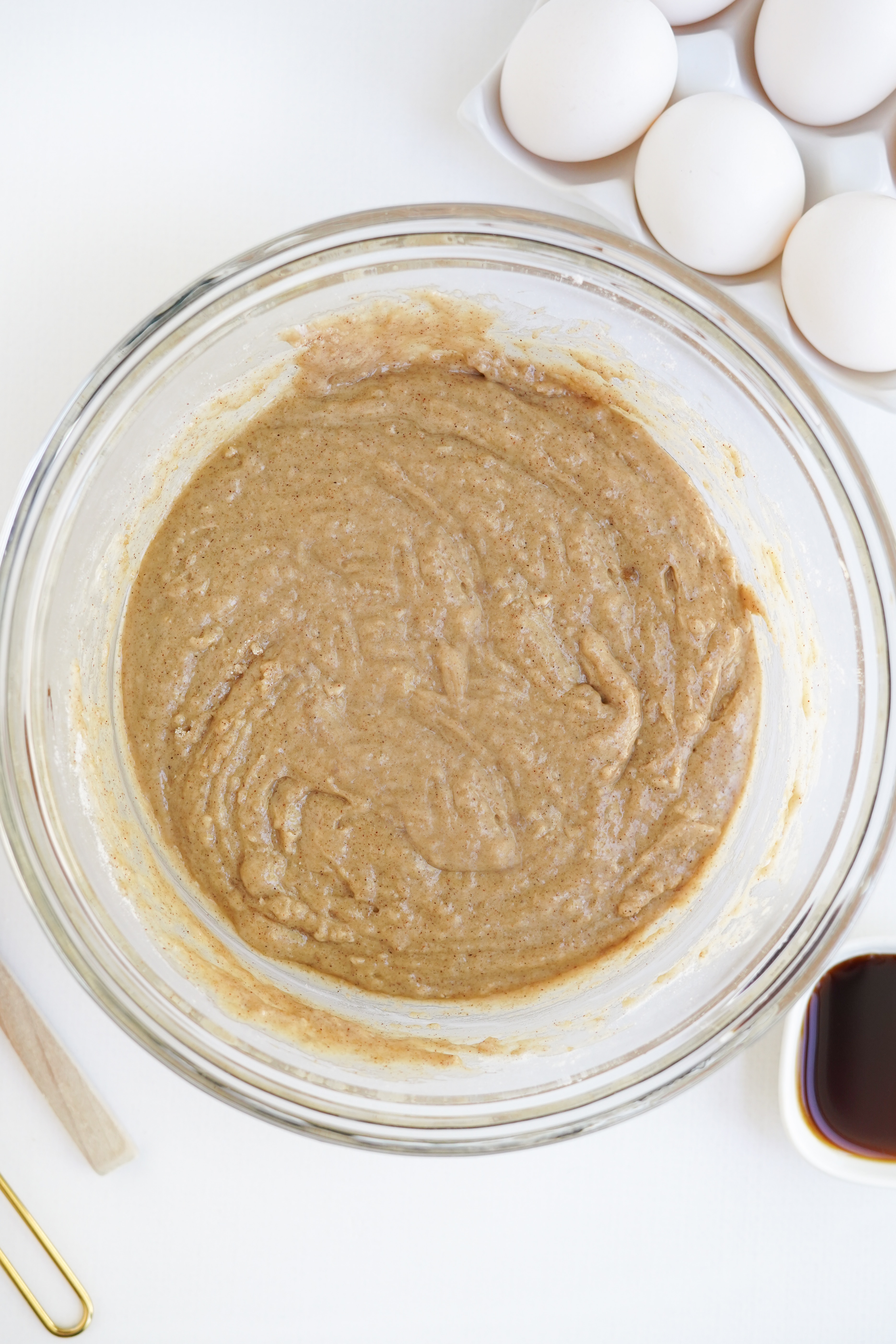 apple cider doughnut batter in glass bowl