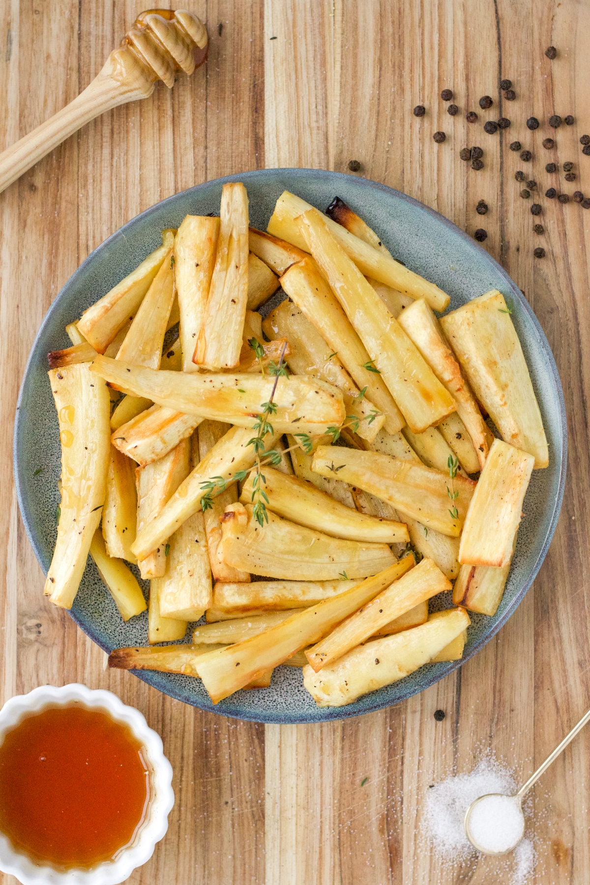 blue plate with honey roasted parsnips