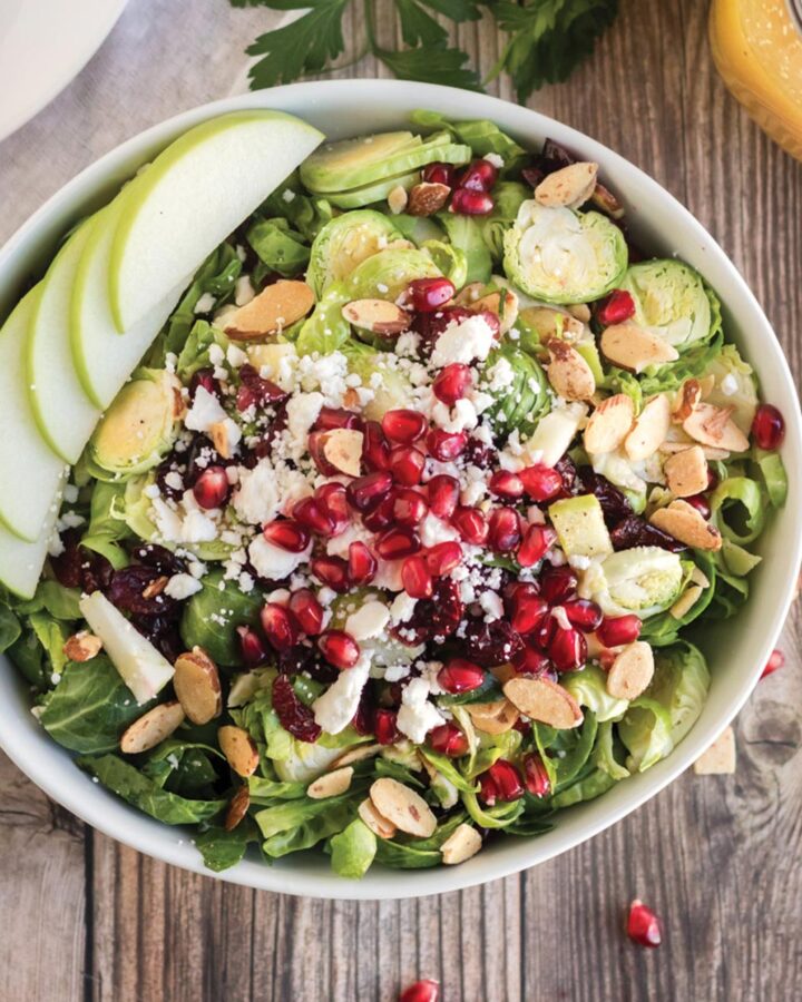Brussels sprout salad with feta cheese, pomegranate seeds and almonds.