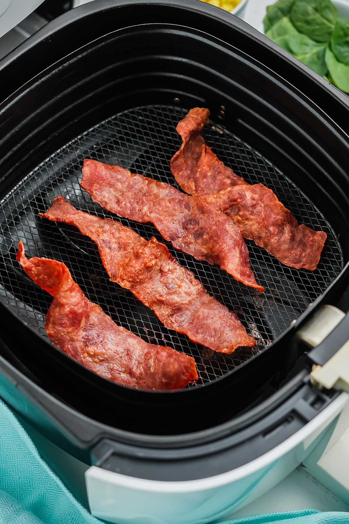 Cooked air fryer turkey bacon in the air fryer.