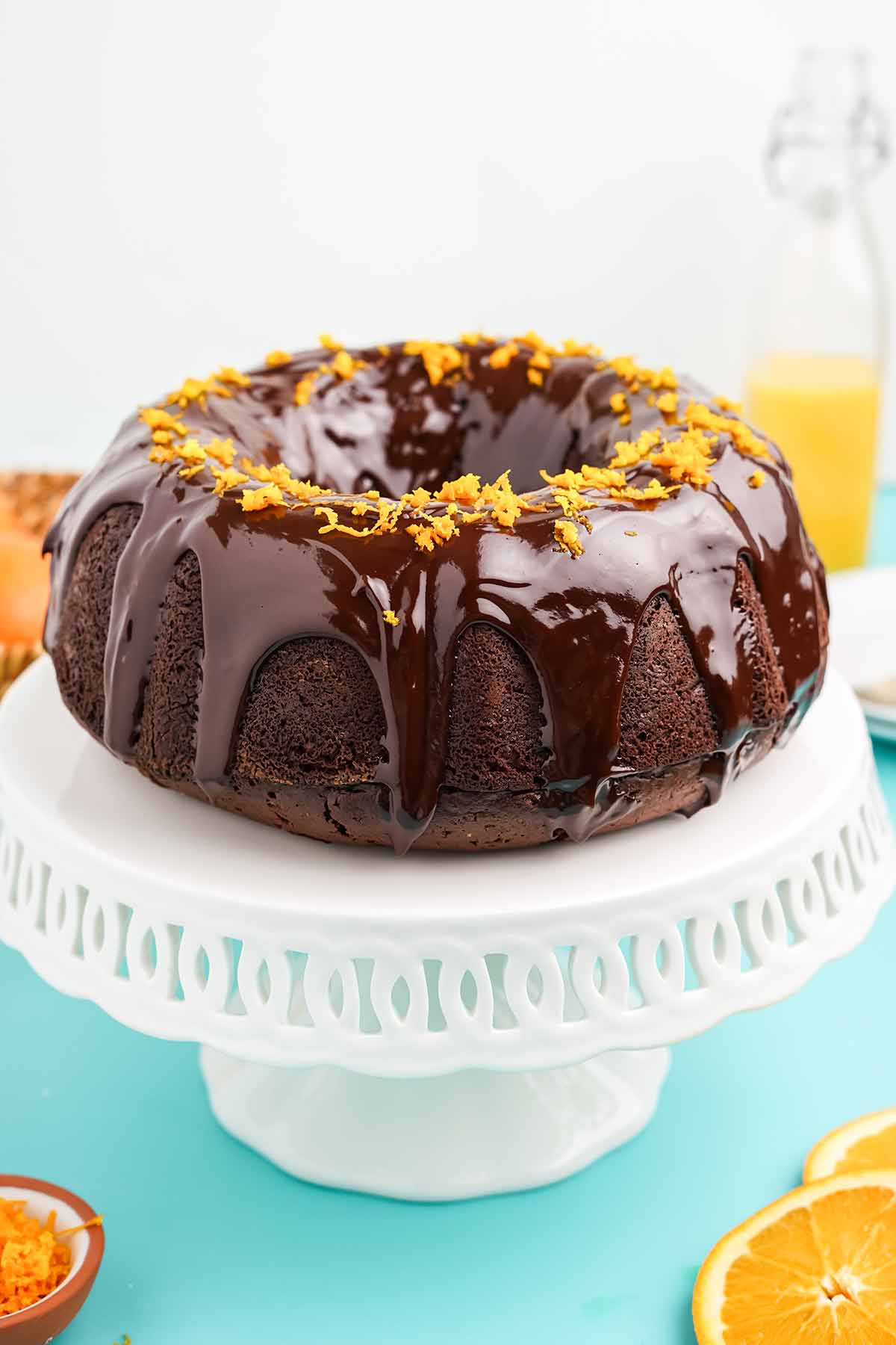 Chocolate orange bundt cake on a pedestal.