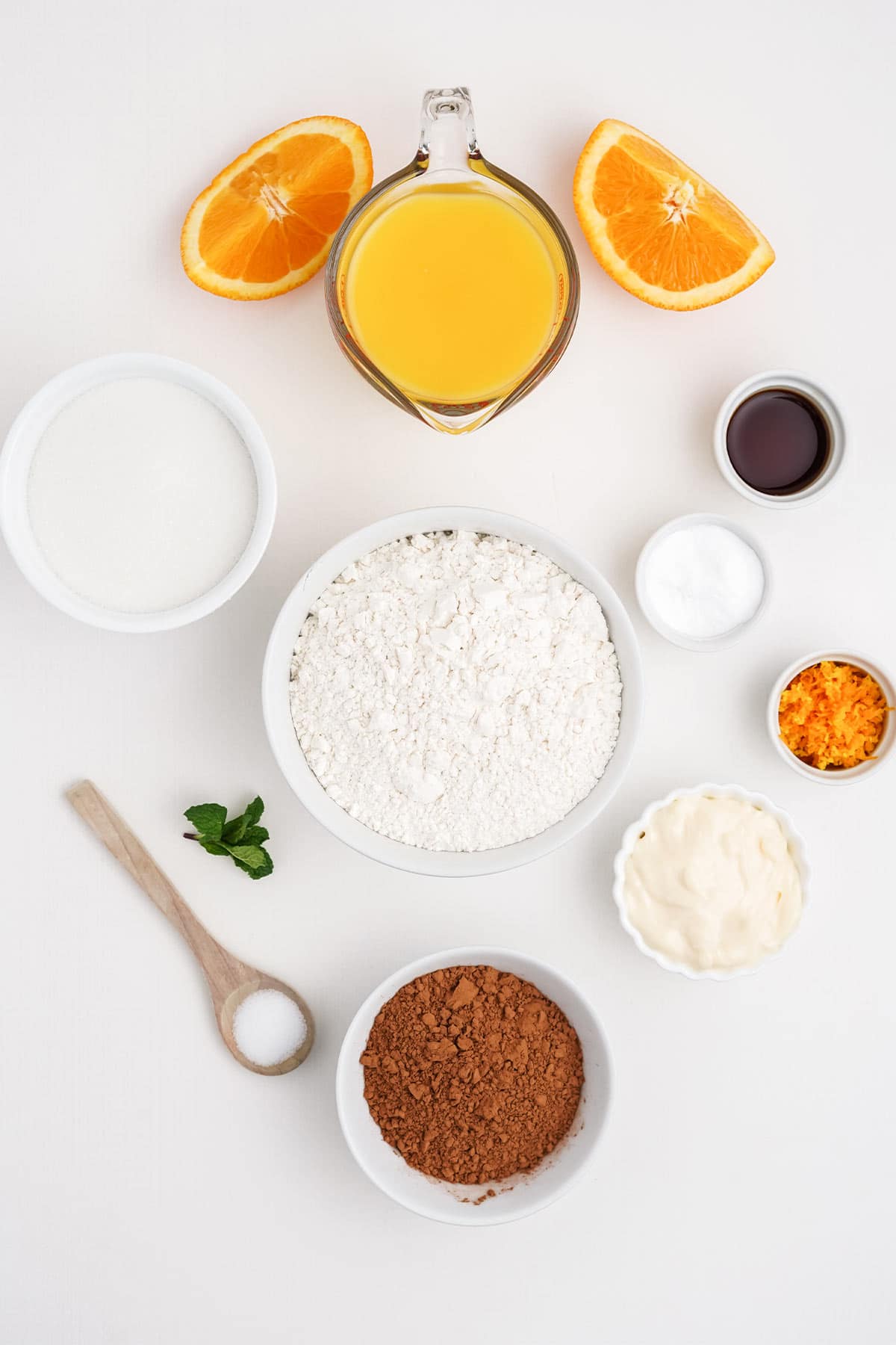 Ingredients to make chocolate orange bundt cake on the table.