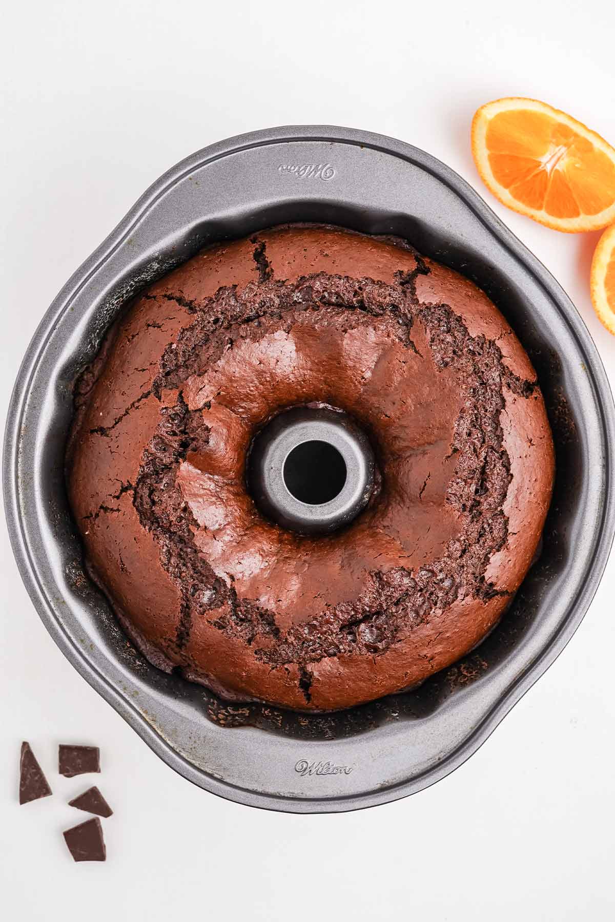 Chocolate orange bundt cake fresh from the oven in the pan.
