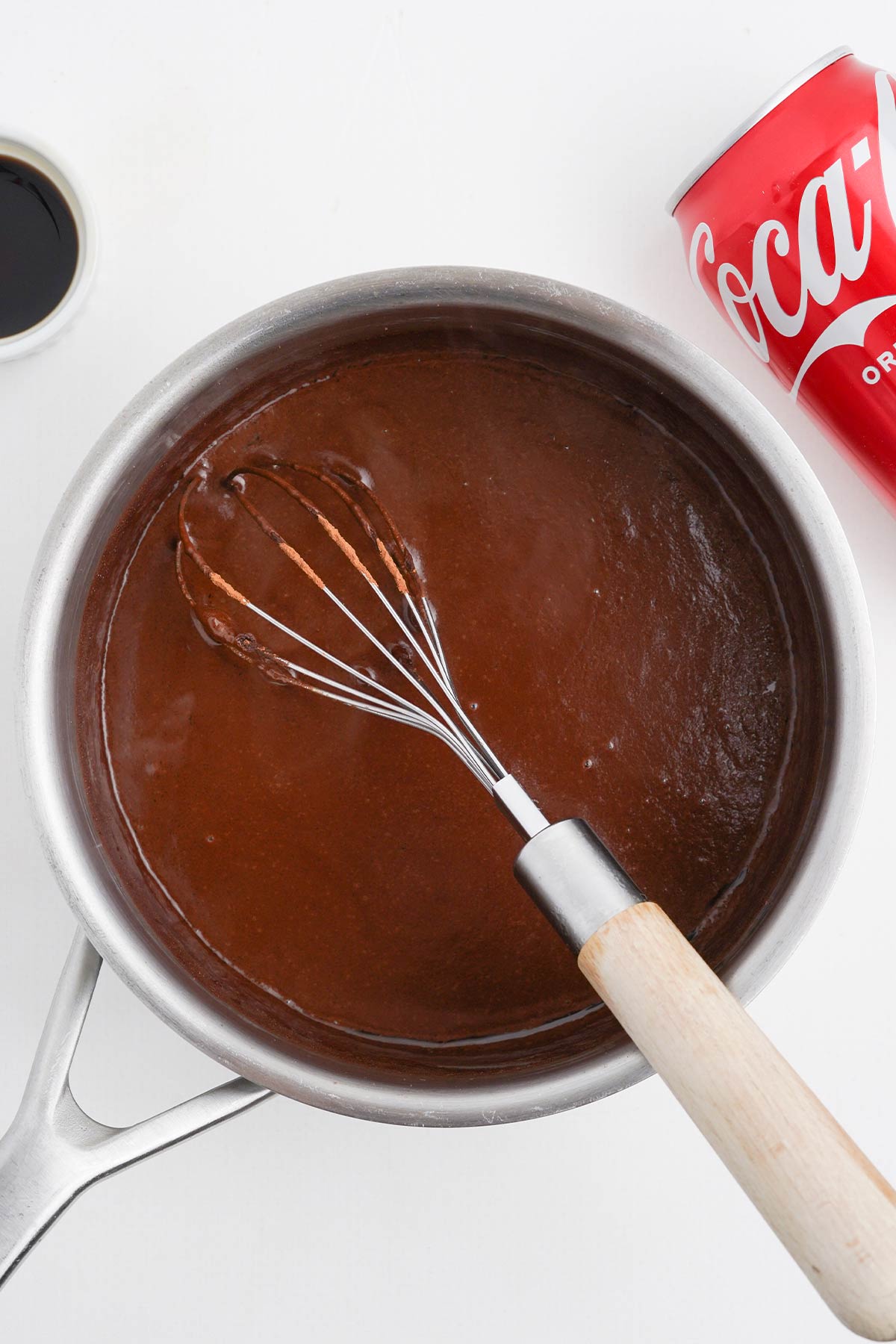 Chocolate icing in a saucepan to make coca cola cake.