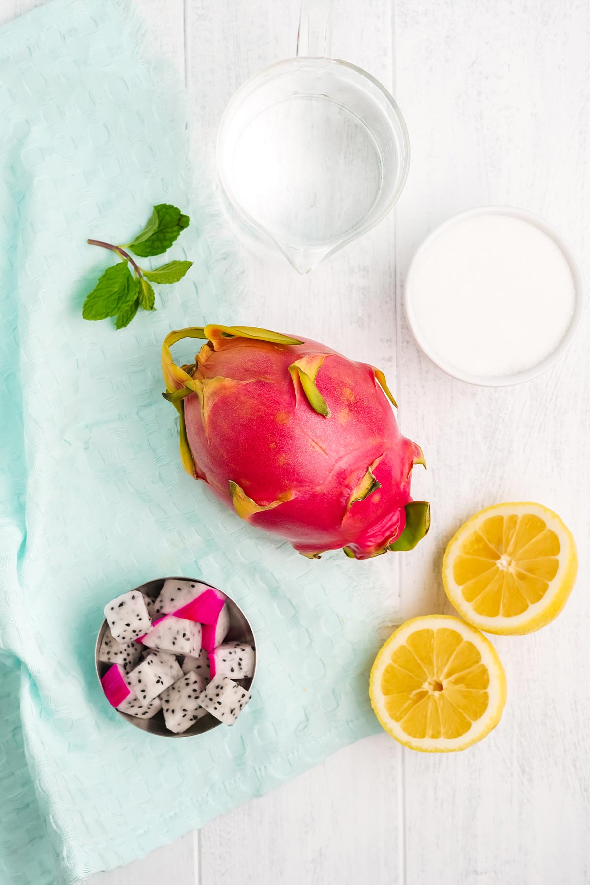 Ingredients to make dragon fruit lemonade on the table.