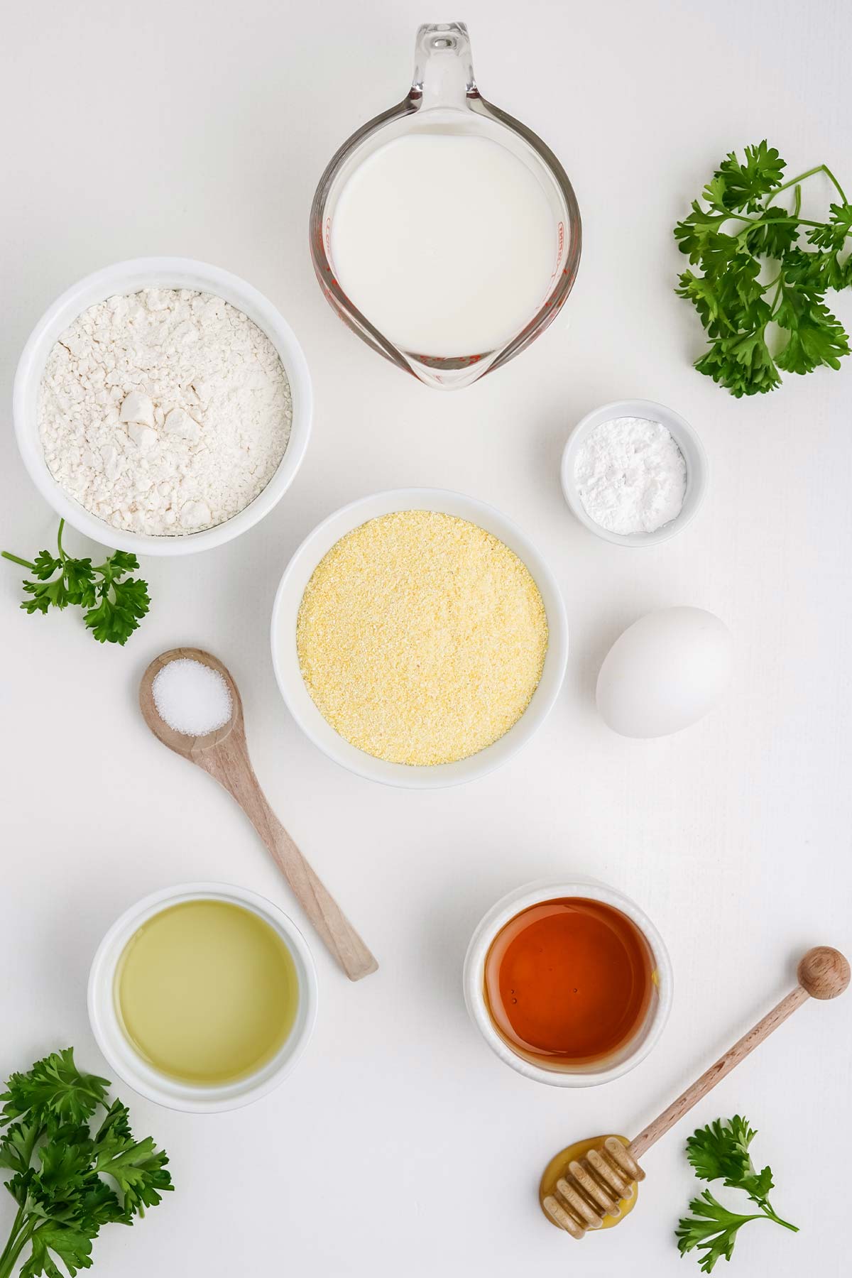 Ingredients to make cornbread with honey on the table.