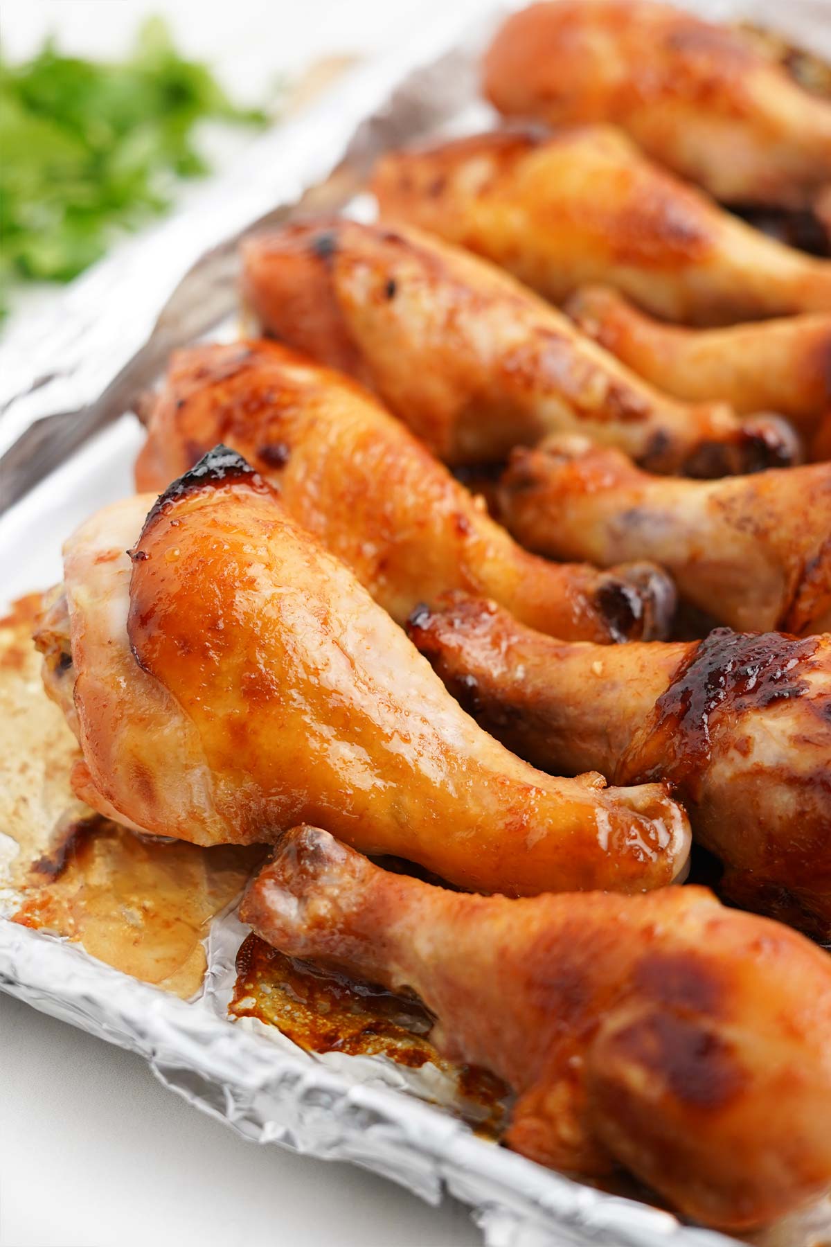 Baked chicken drumsticks on the table.