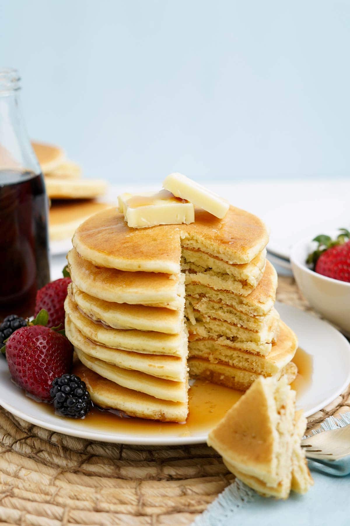 Stack of oat milk pancakes cut into showing the inside.