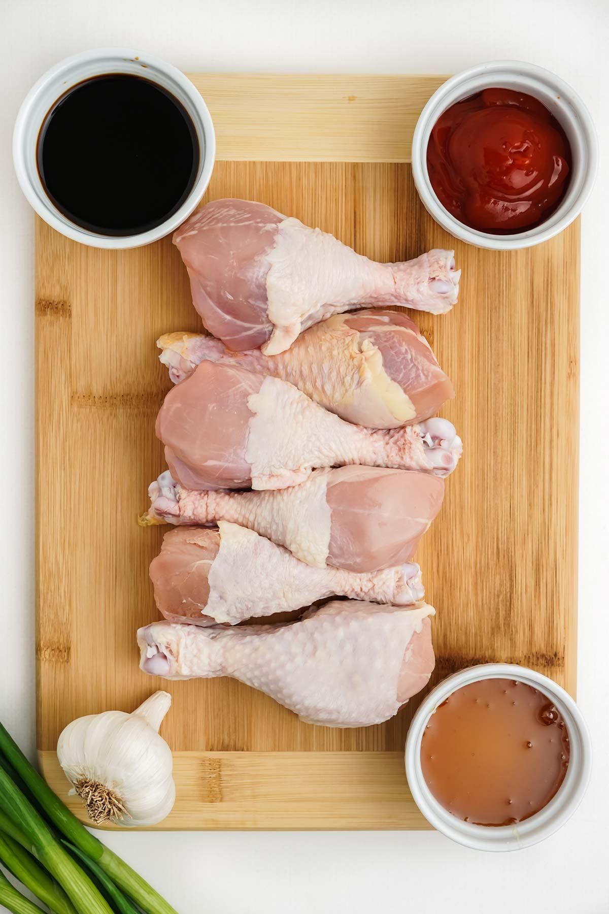 Ingredients to make slow cooker chicken drumsticks on the table.