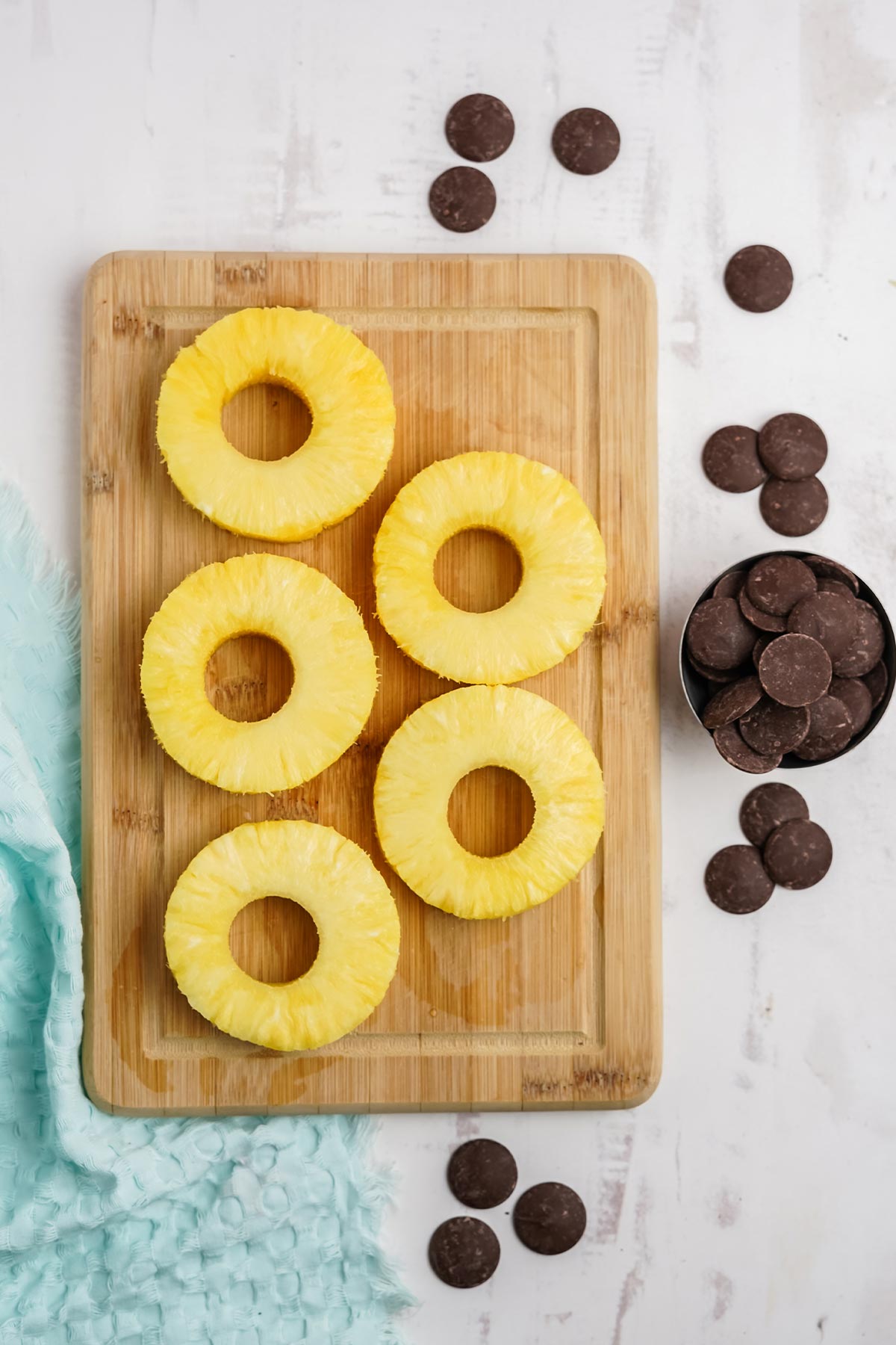 Ingredients to make chocolate covered pineapple.