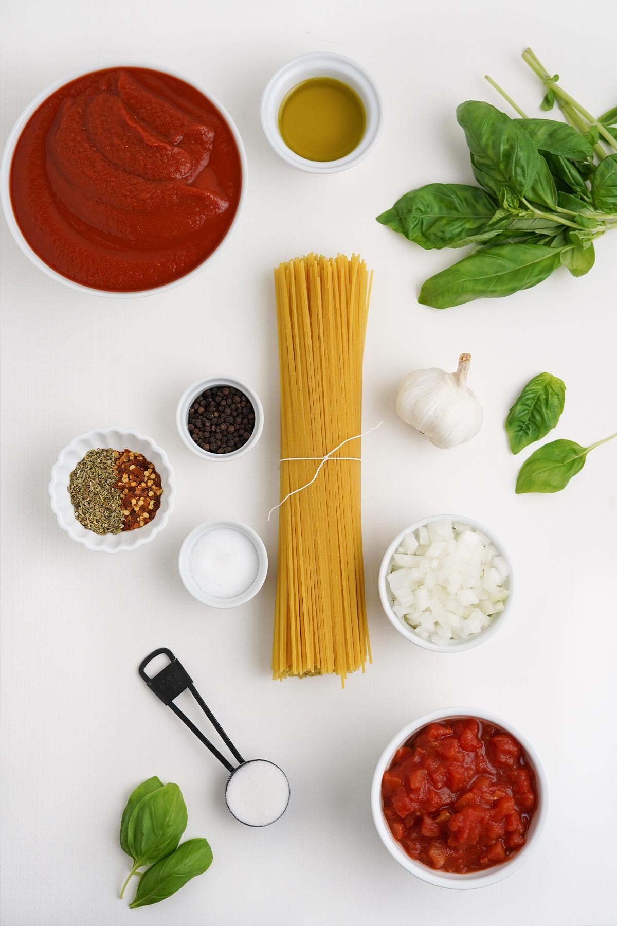 Ingredients to make spaghetti arrabiata on the counter.