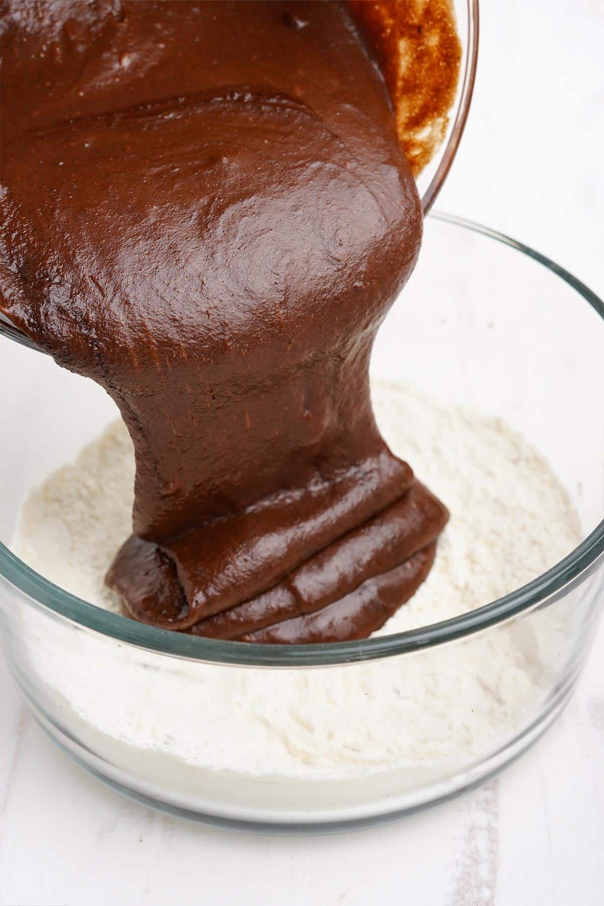 Pouring the chocolate batter into the flour.