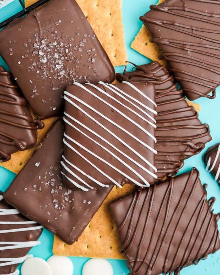 Chocolate covered graham crackers are ready to eat on the table.