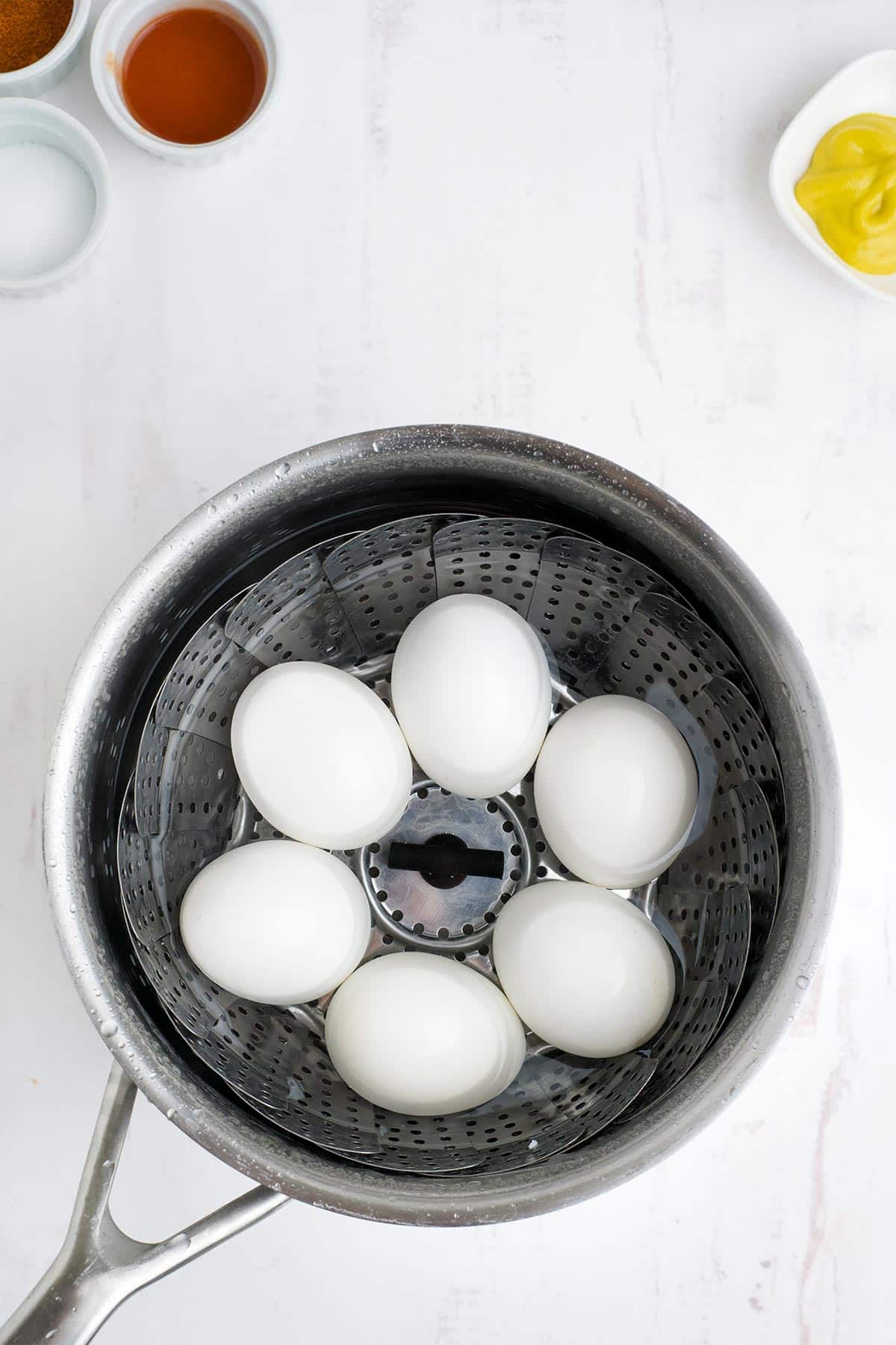 Eggs boiled in a pot.