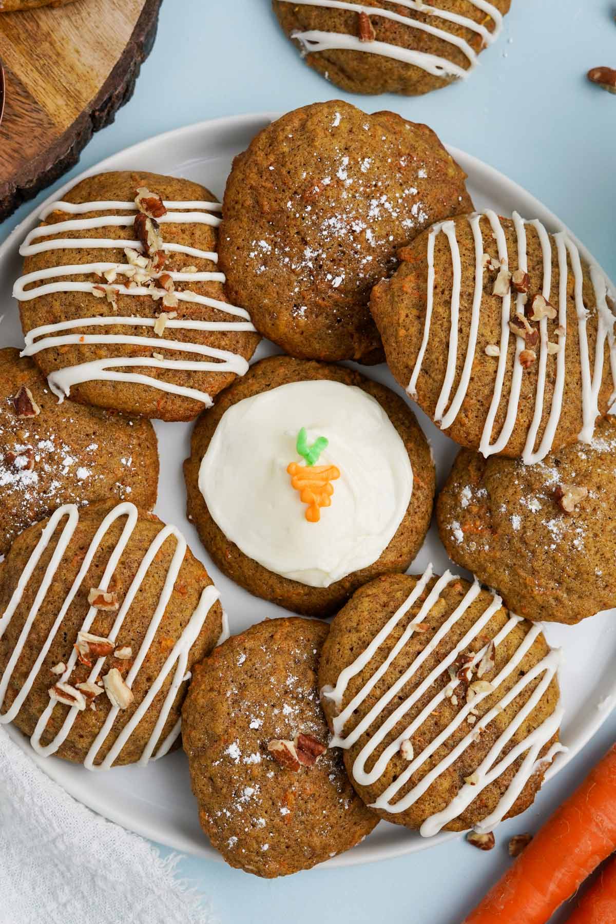 A close up of carrot cake cookies on a plate.