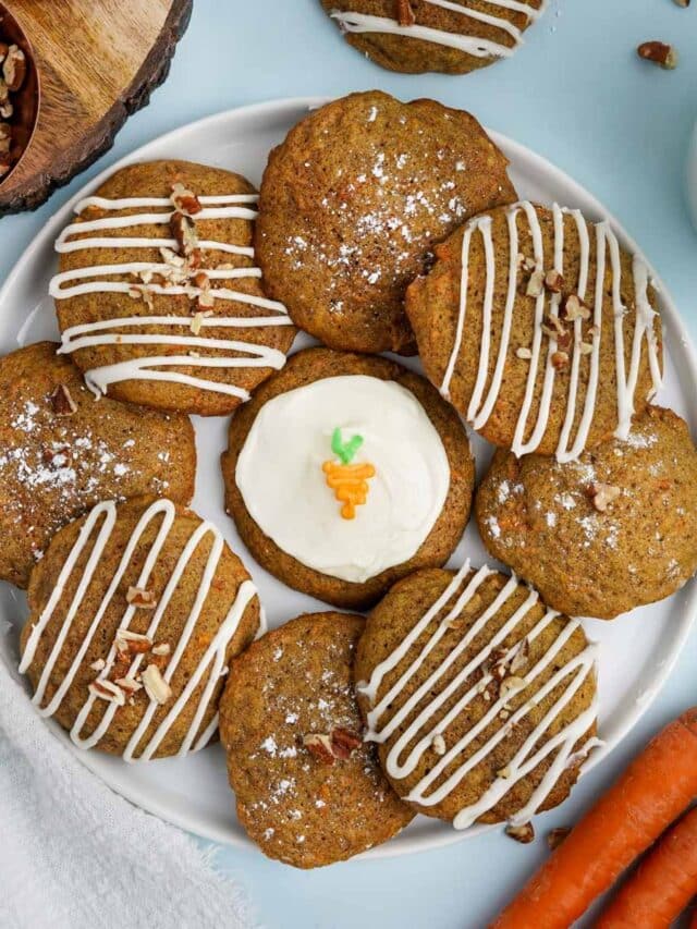 Carrot cake cookies with cream cheese icing on a plate on the table.