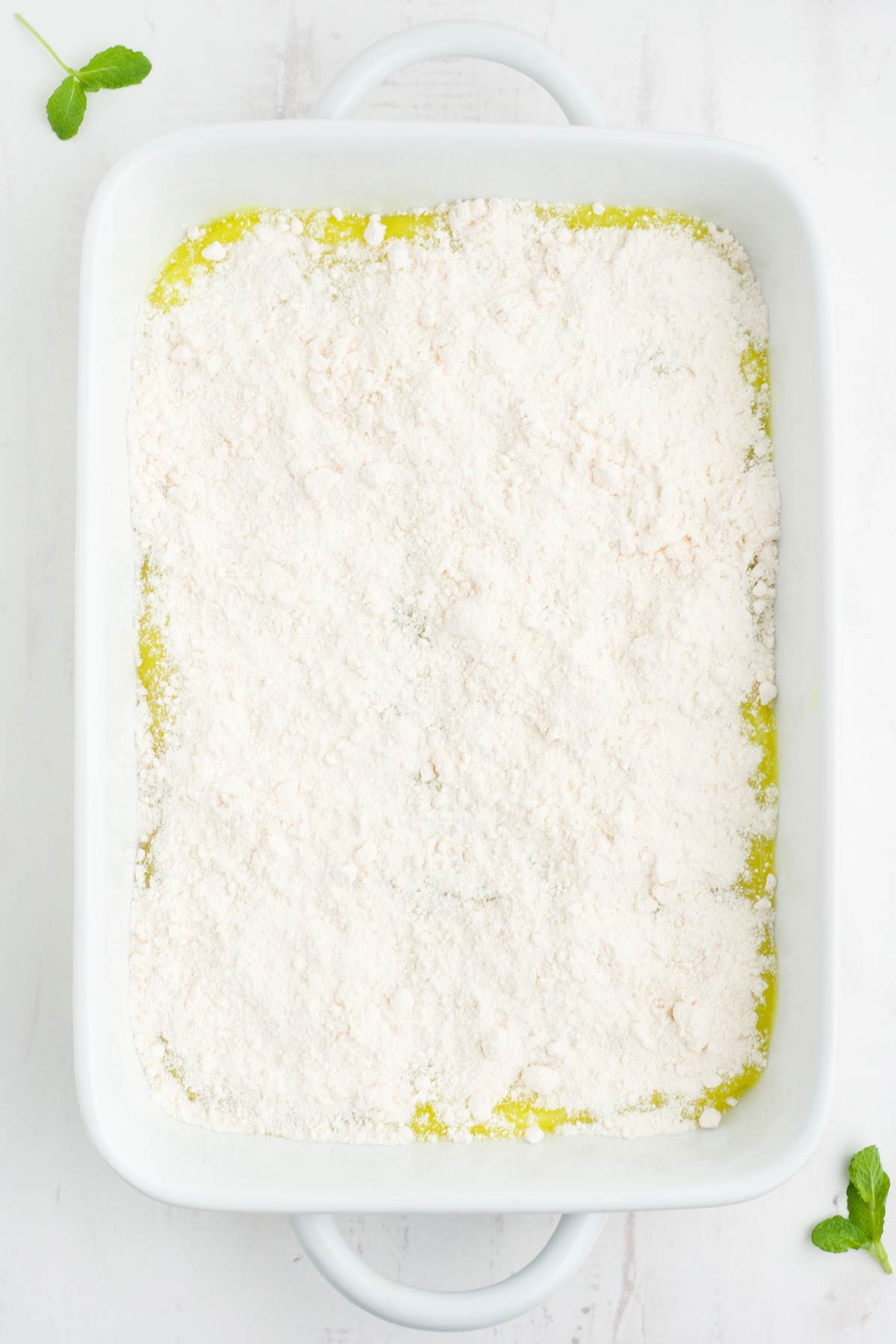 Cake mix sprinkled over the lemon filling.