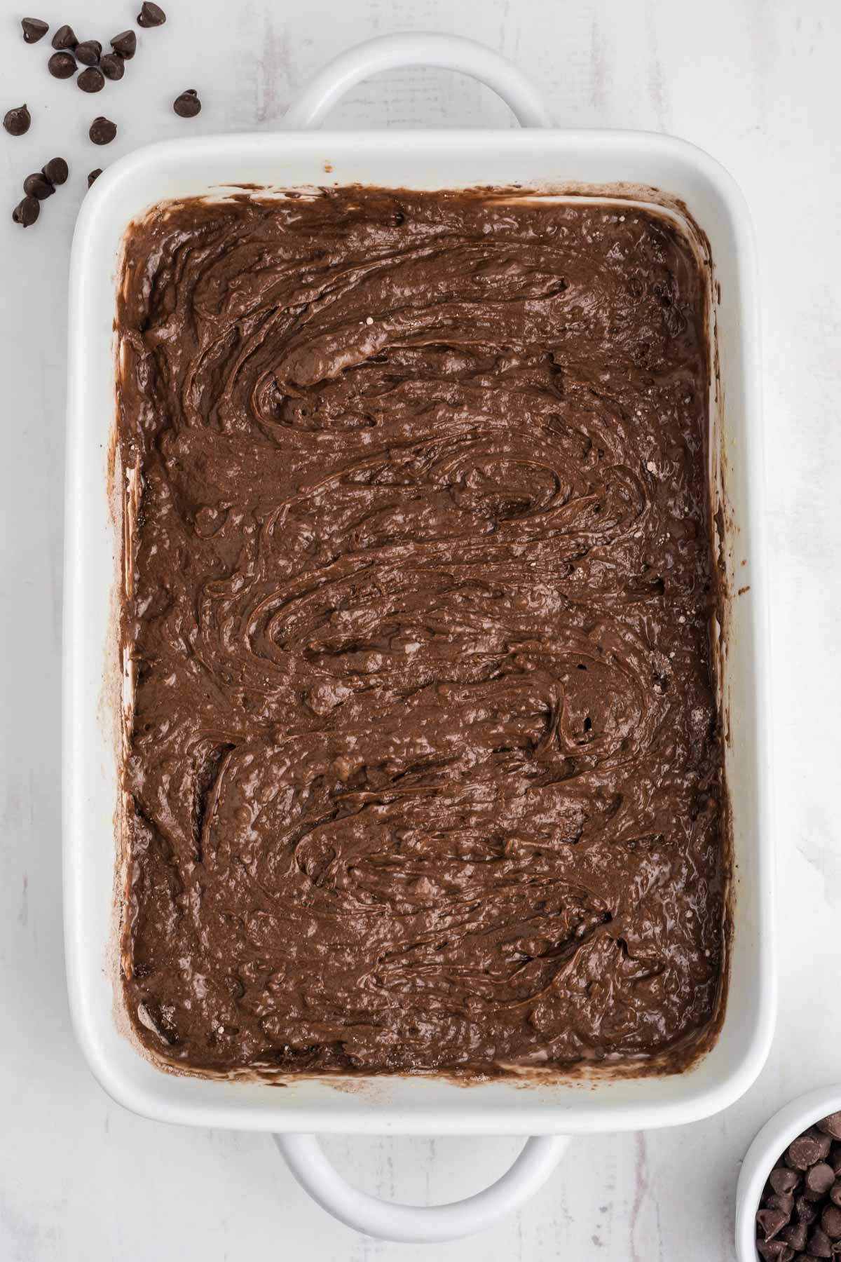 Chocolate dump cake mixture in the pan.