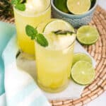 Pineapple agua fresca in glasses on a wicker placemat.