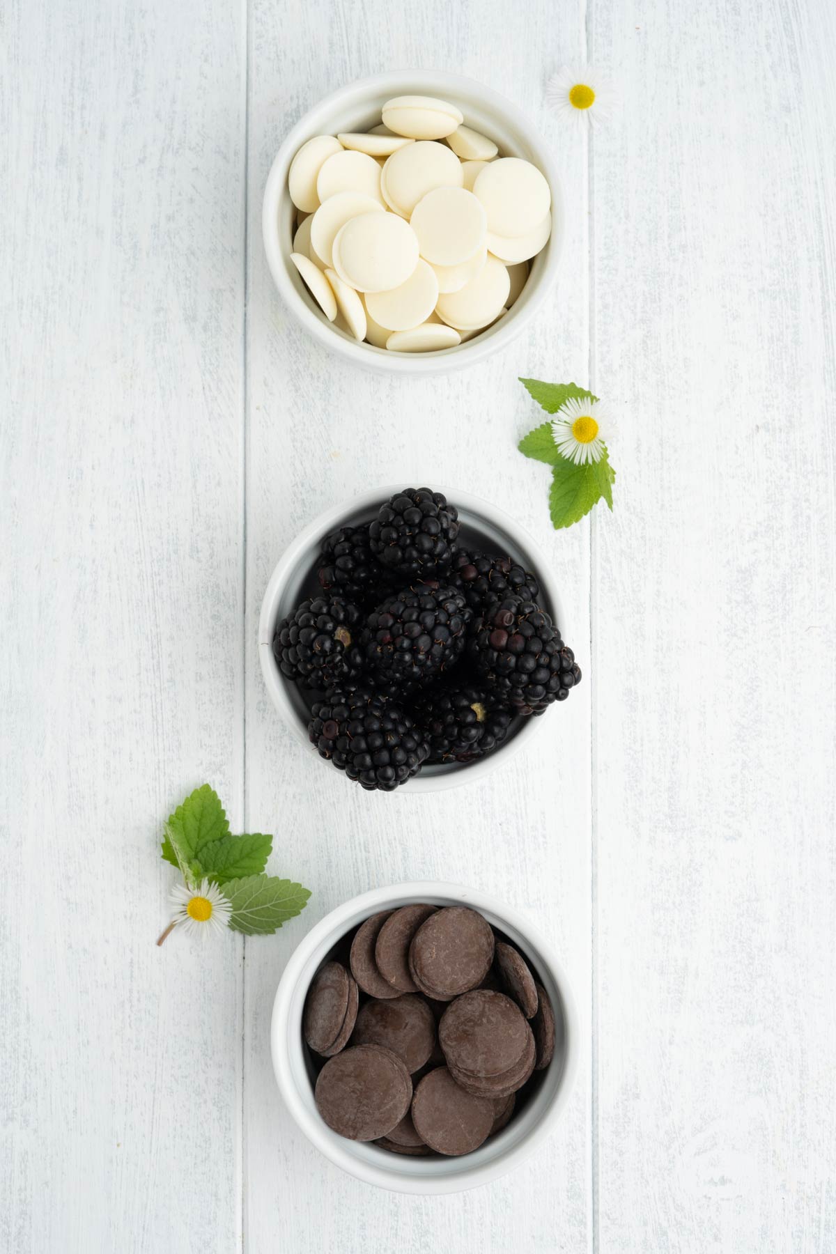 Ingredients to make chocolate covered blackberries on the table.