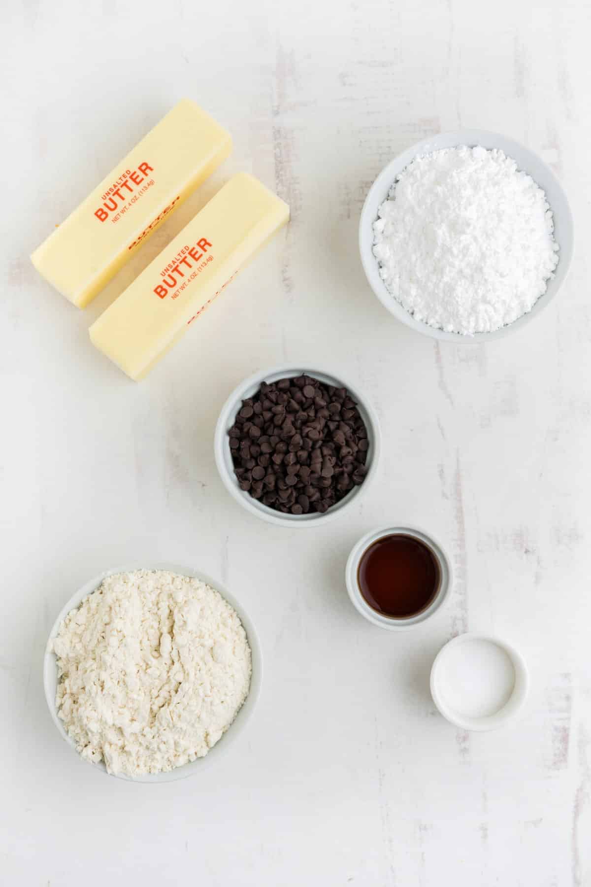 Ingredients to make snowball cookies without nuts on the table before mixing.