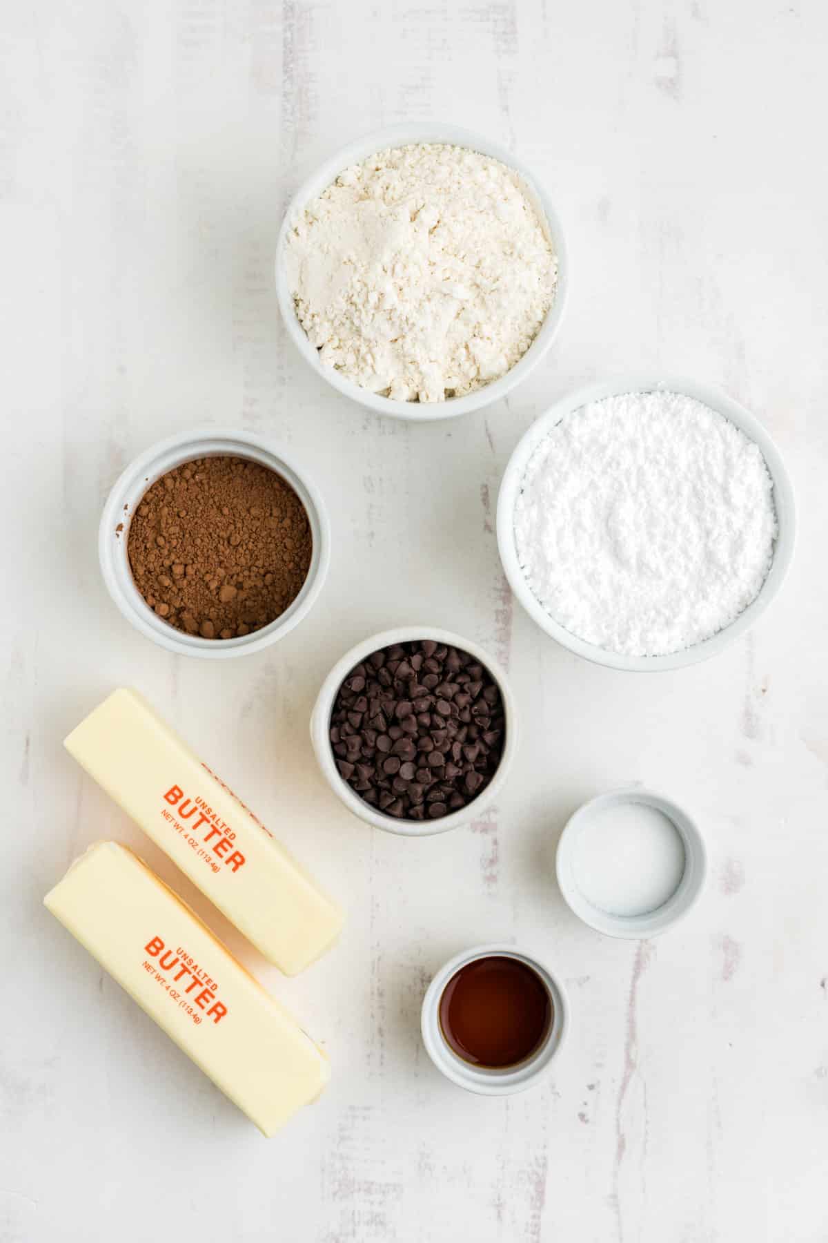 Ingredients to make chocolate snowball cookies on the table.