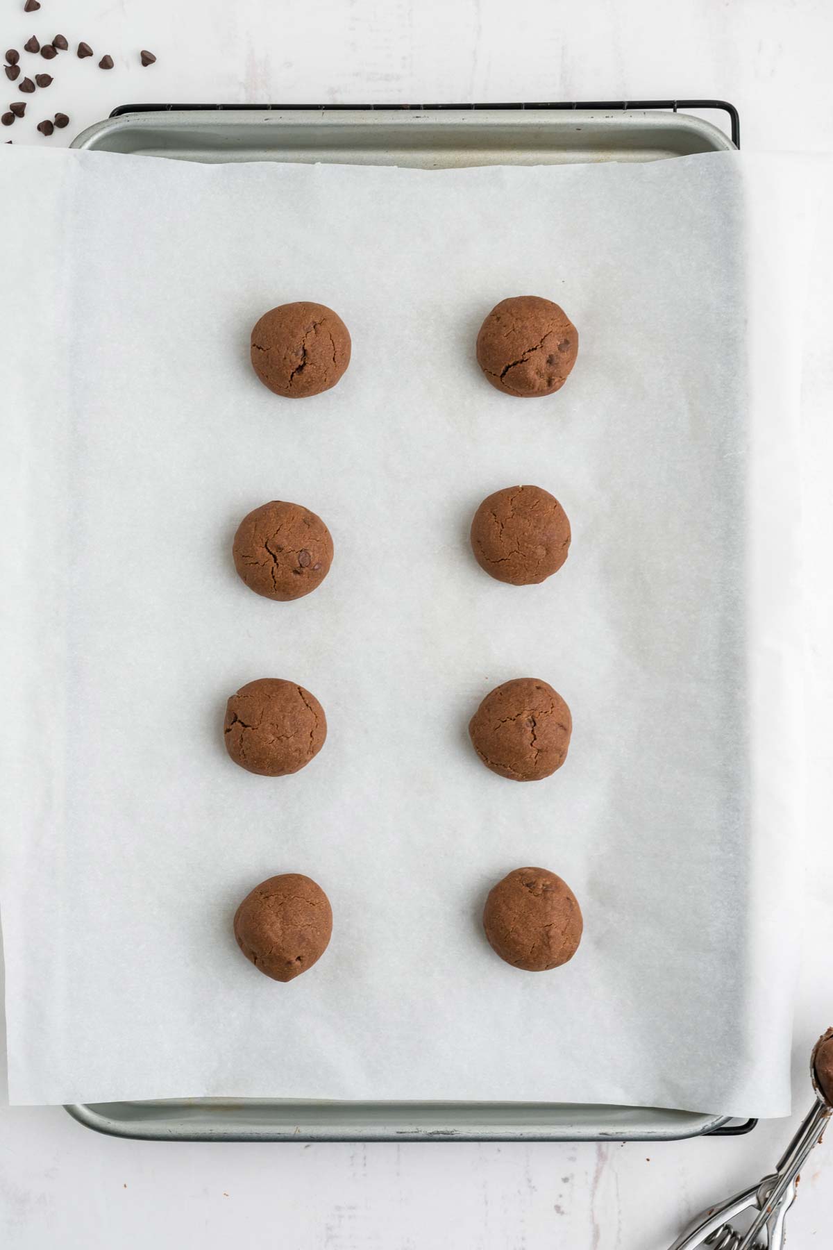 Chocolate cookies on a baking pan after baked.