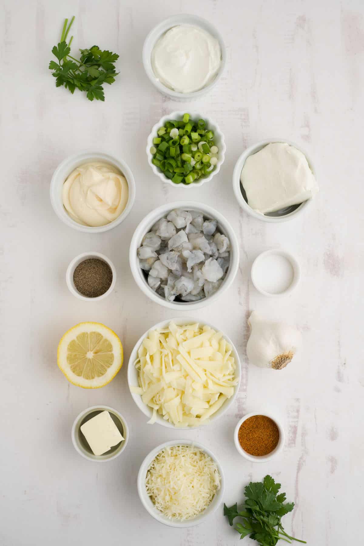 Ingredients to make hot shrimp dip on the table before mixing.