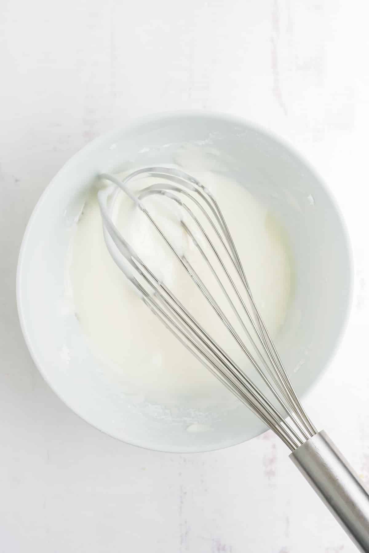 Mixing the icing for the easter cookies.