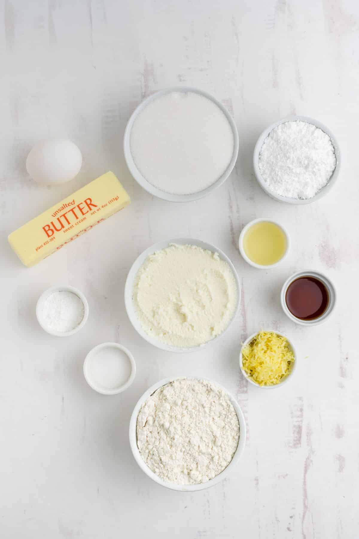 Ingredients to make lemon ricotta cookies on the table before mixing.