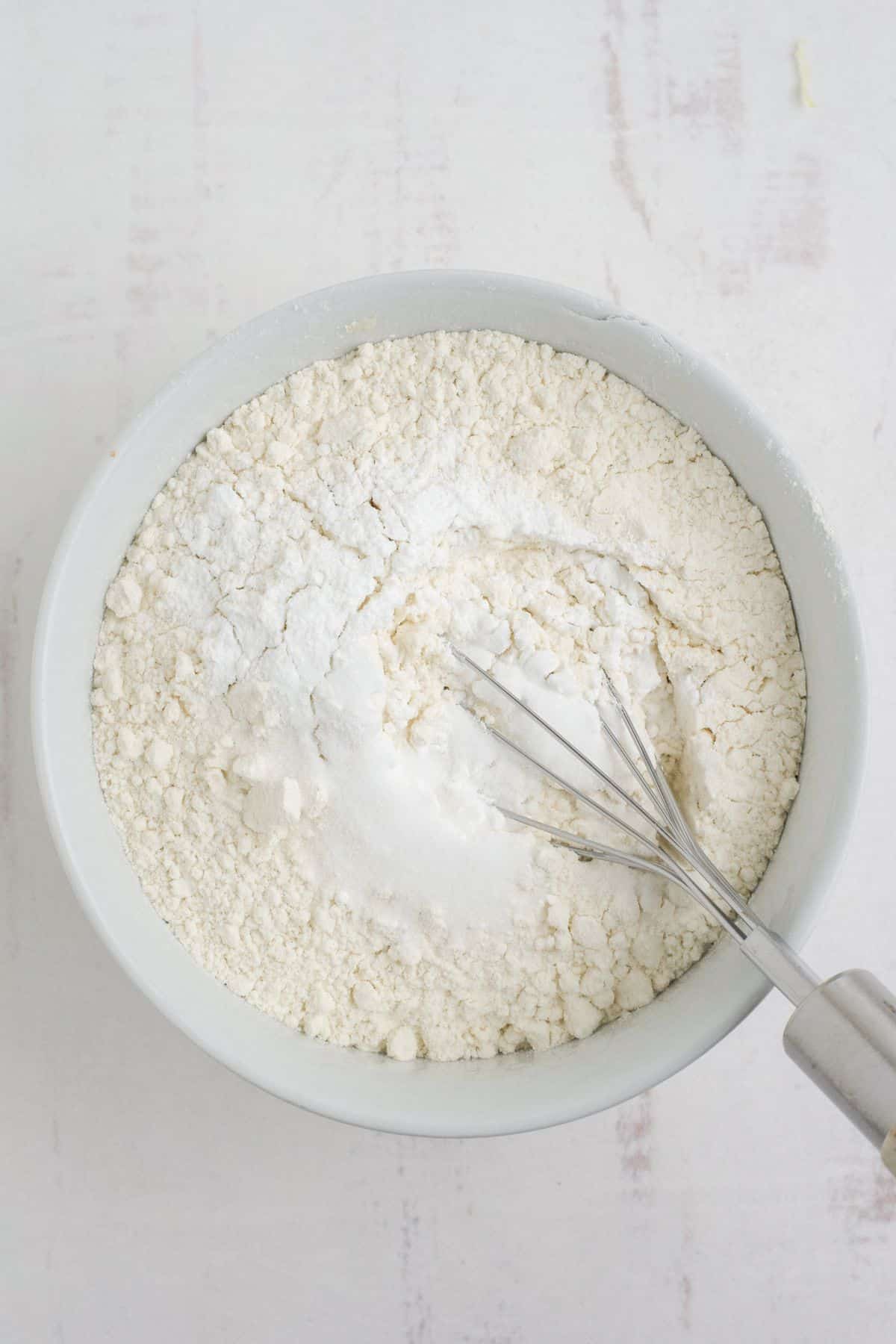 Mixing the dry ingredients together in a separate bowl.