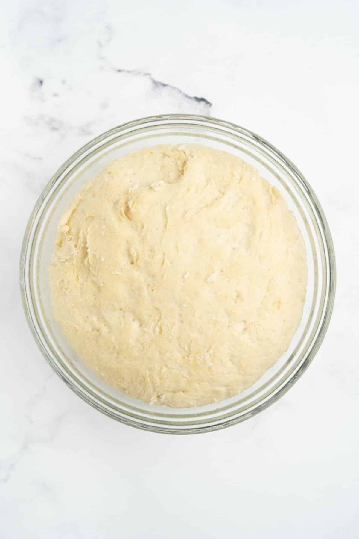 Dough after it's doubled in size in a bowl.