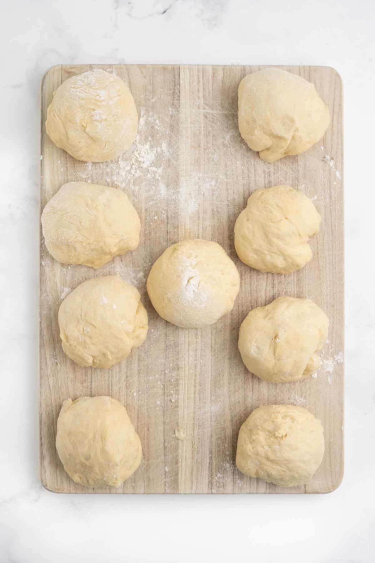 Dough divided up on a cutting board.