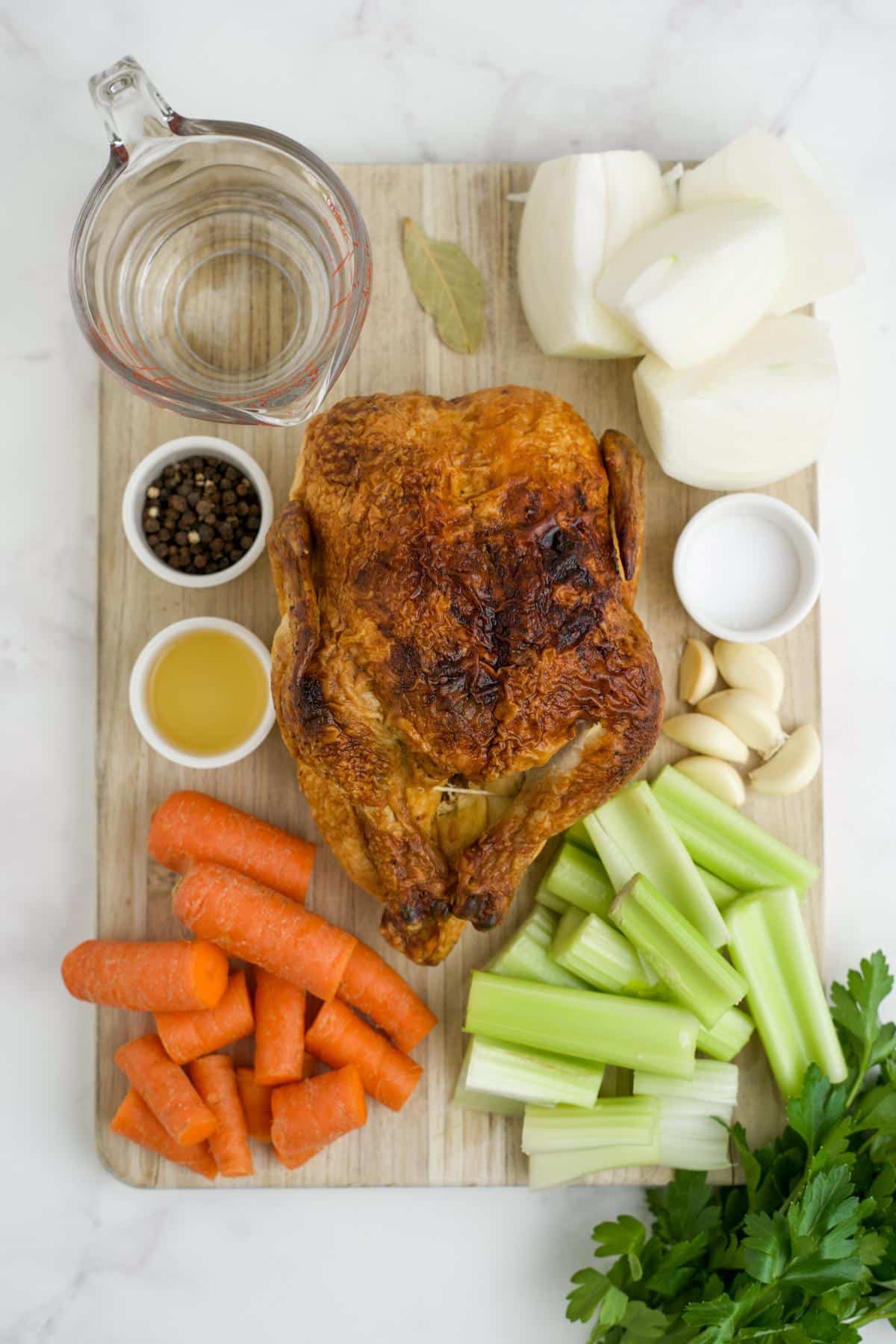 Ingredients to make rotisserie chicken broth on the table before preparing.